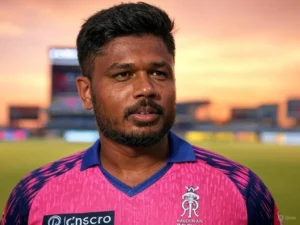 A man in a pink shirt stands in front of a large stadium, showcasing its impressive architecture and vibrant atmosphere